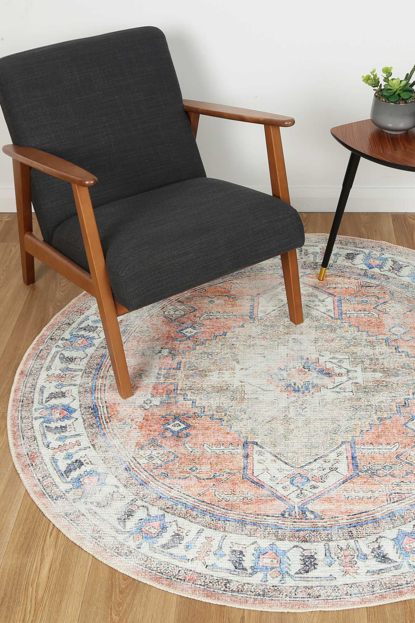 Distressed Vintage Pissarro Terracotta Sky Round Rug under table